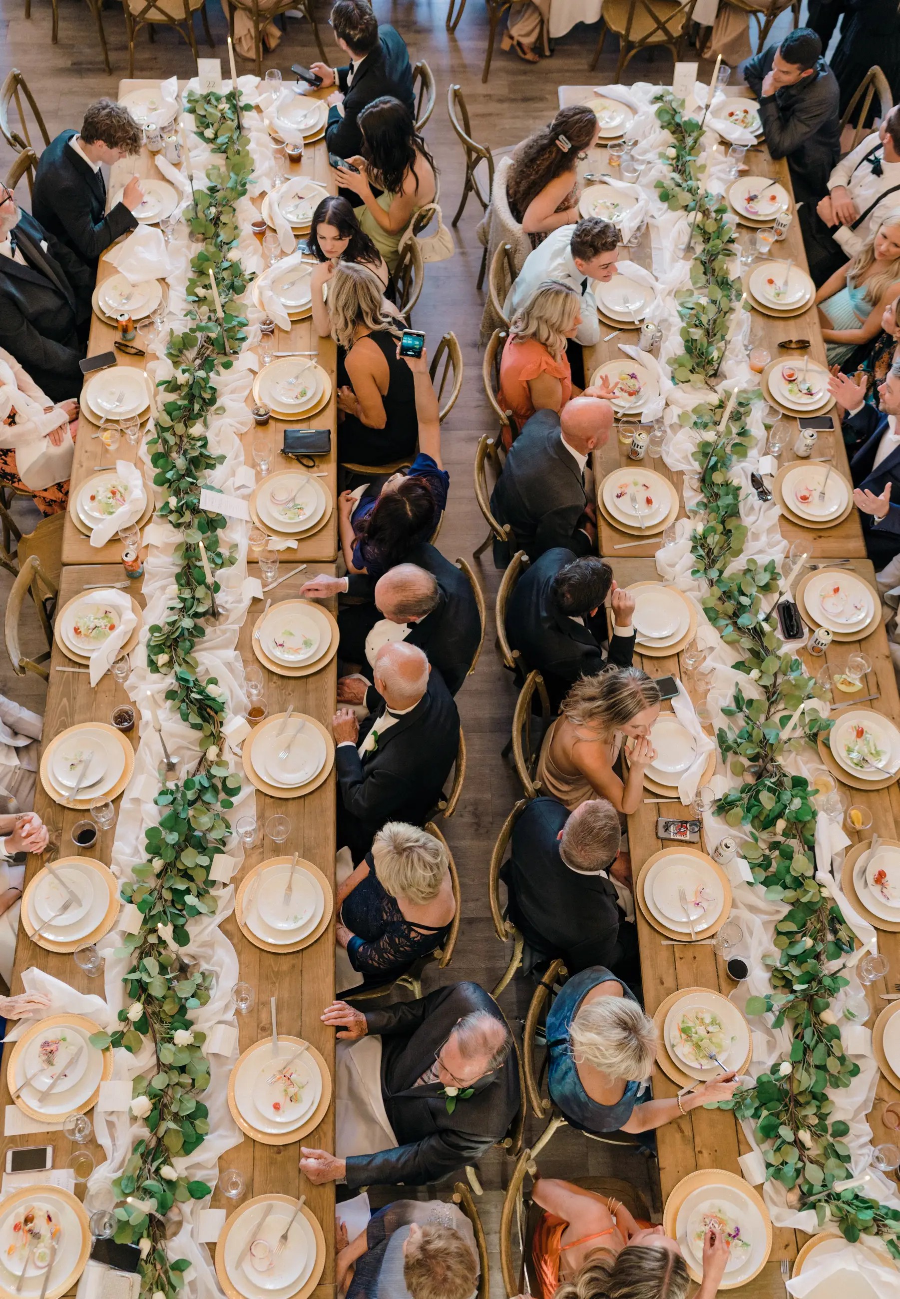 Guest table at wedding greenery down center