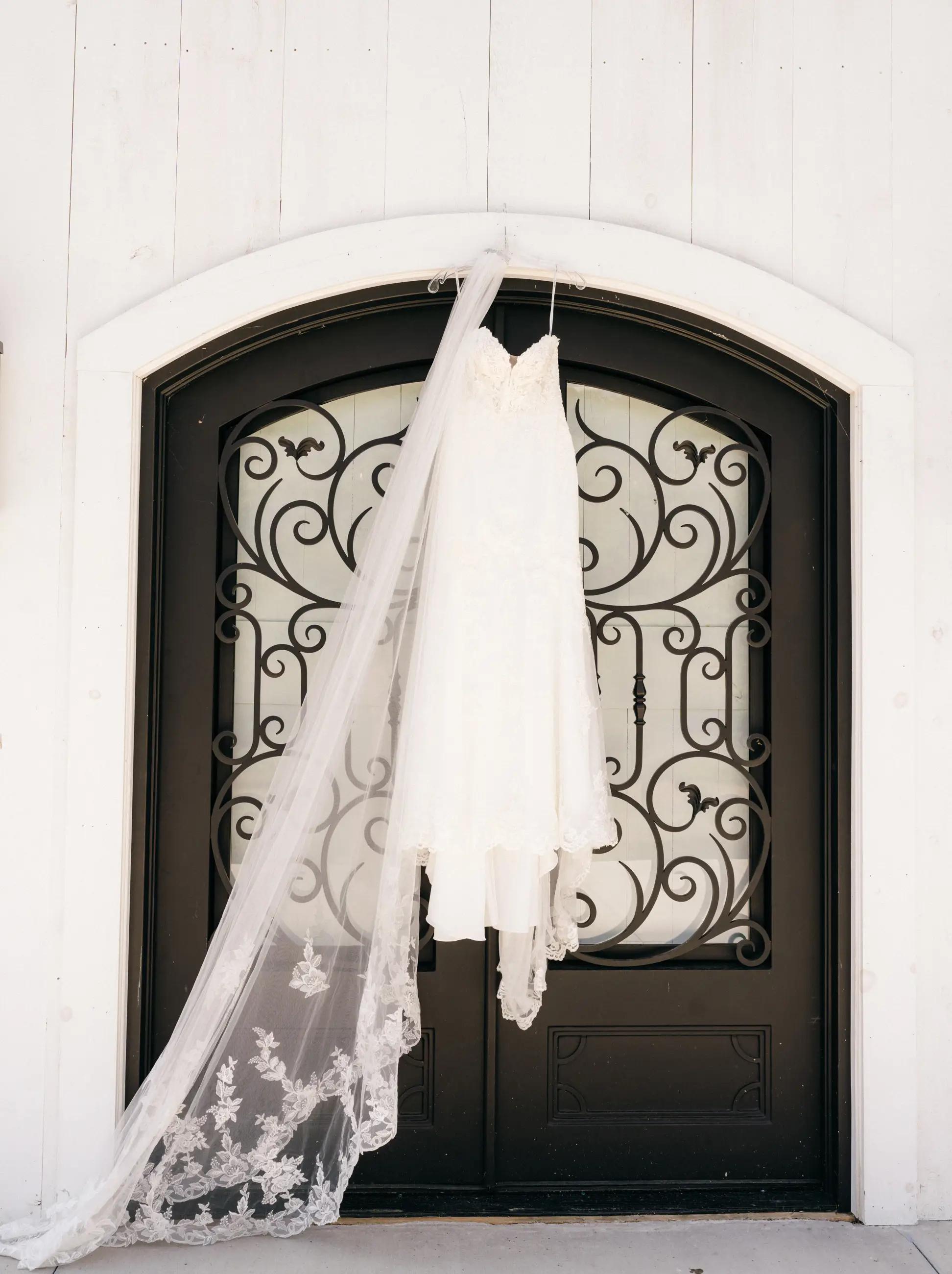 Wedding dress hanging in door