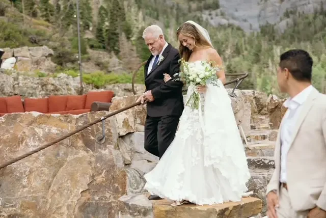 dad walking bride down aisle starcase