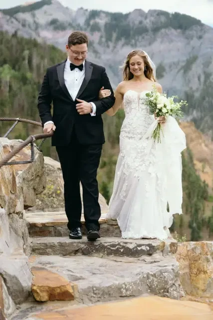 bride and groom on steps
